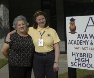Allison Lawhorne and her mother standing in front of the Ava White Academy