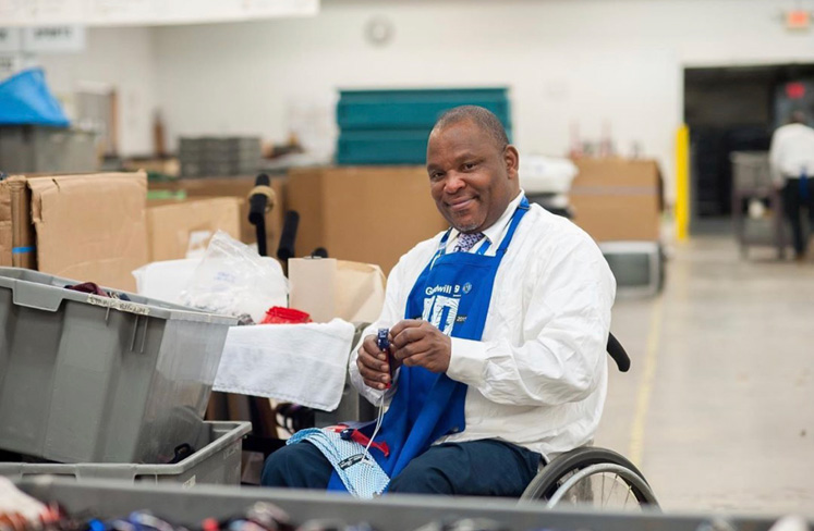man in wheelchair working at Goodwill