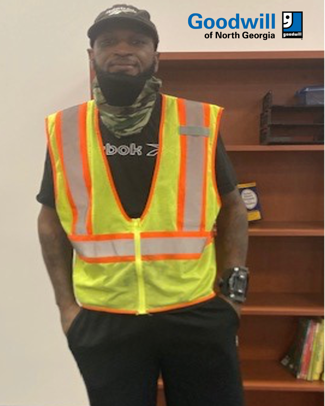 Male participant posting with a safety vest on
