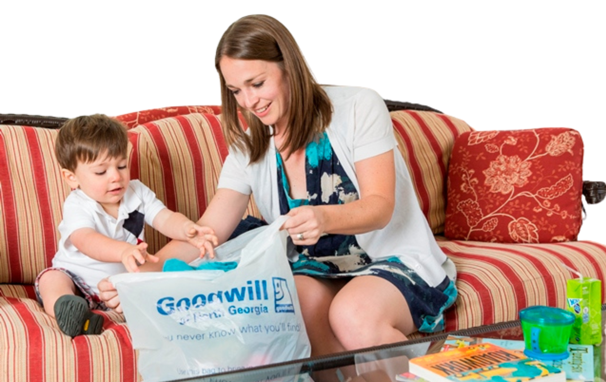 Mom and young boy filling bag with donations