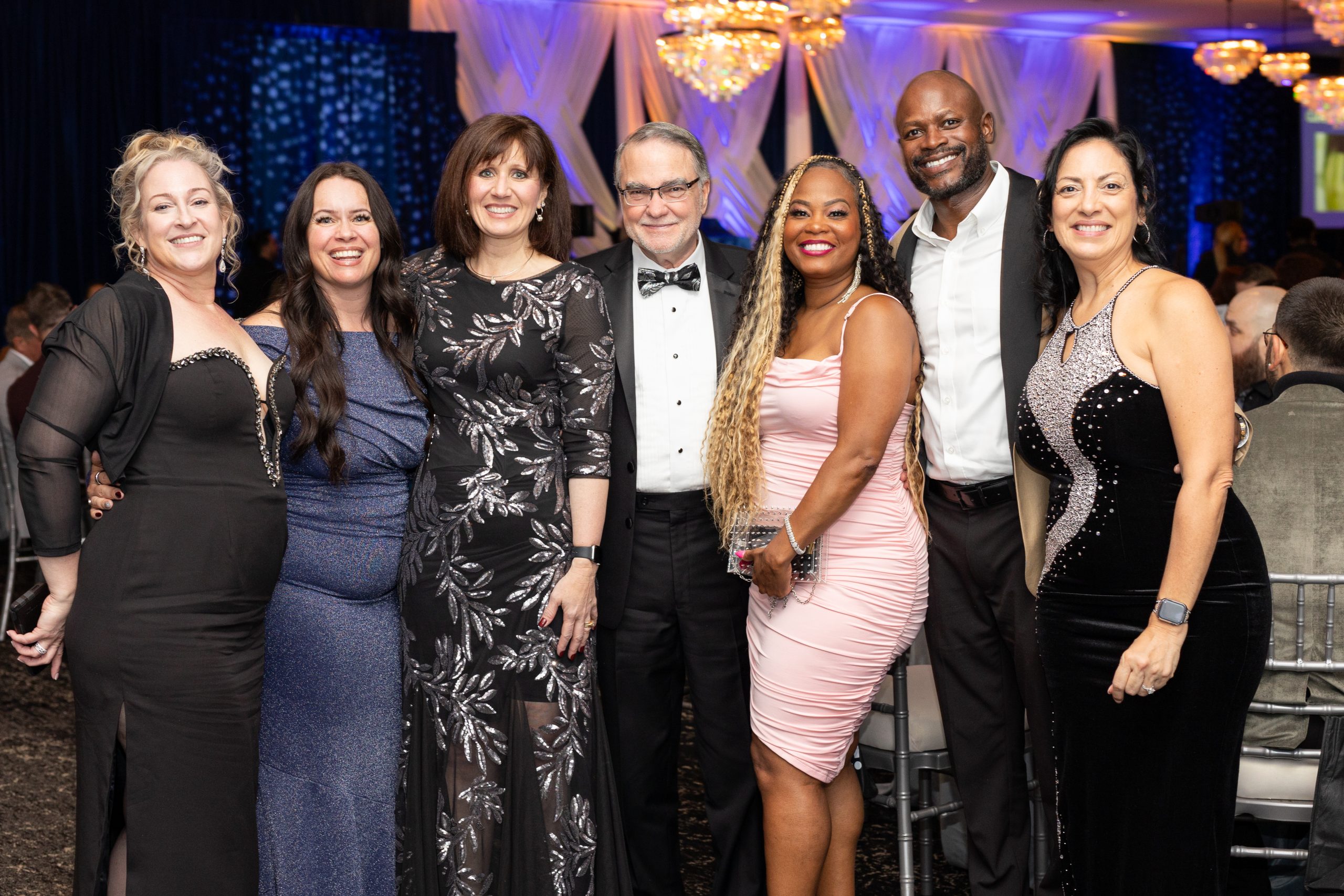 A group photo at a gala event.