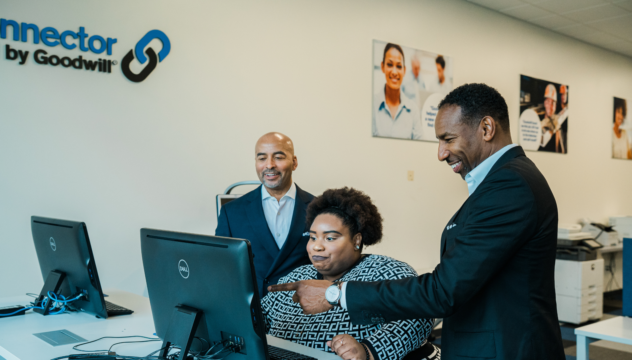 image of CEO Keith, Mayor and Veronica Lightburn at a computer in the career center